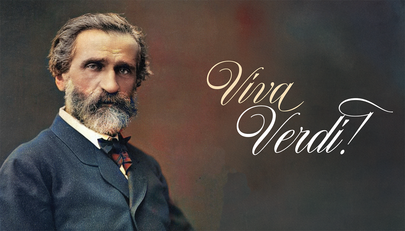 A colorized photo portrait of Giuseppe Verdi, a man with short brown hair, low eyebrows, deeply-set brown eyes, a full but greying mustache and beard, a small blue and red striped cravat, a stiff white shirt collar, and a deep blue suit jacket. To the right of his portrait is pale yellow and white cursive text reading "Viva Verdi!" Both his portrait and the writing is set against a background that is black along the edges but fades to dark reddish brown in the center.